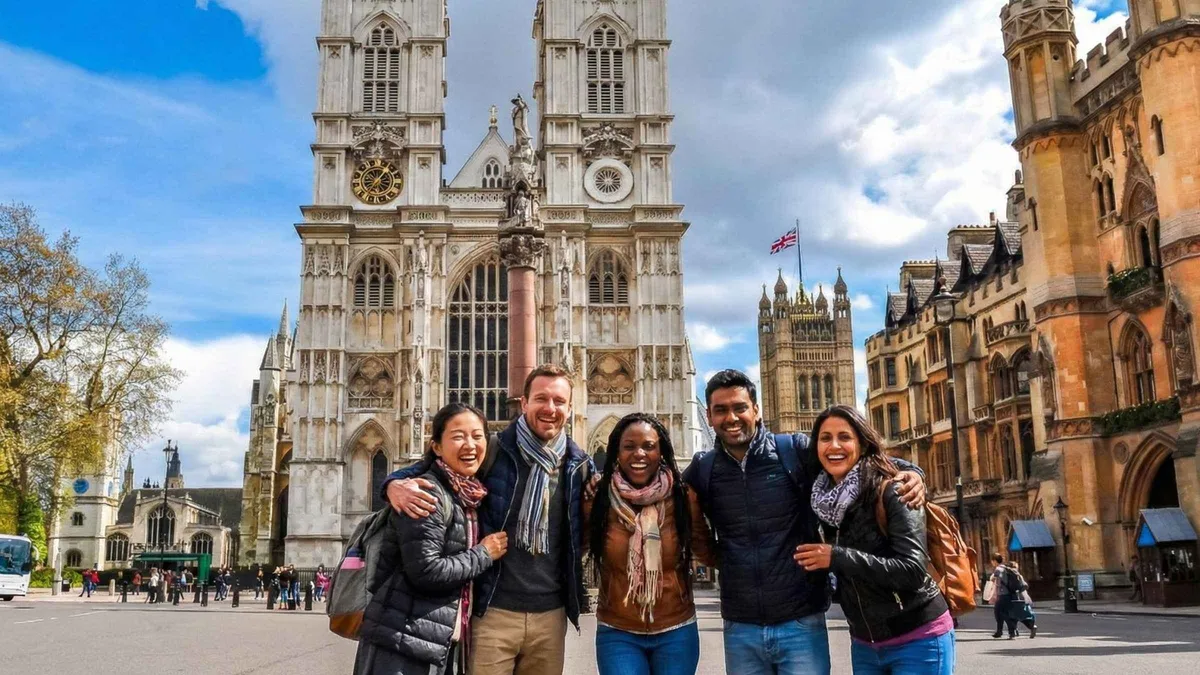 Guided group outside Westminster Abbey with Big Ben behind on day 1 of a London 2 day itinerary